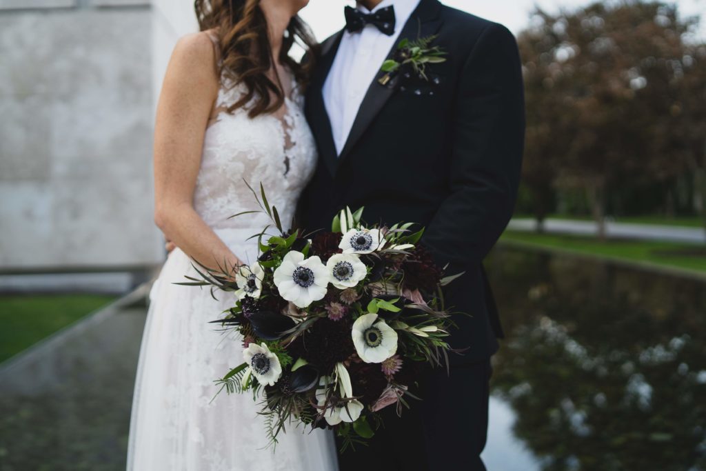 Modern Organic Museum Wedding Bridal Bouquet with Anemones, Black Dahlias and textural greenery at the Barnes Foundation by Sebesta Design. Photography by Max Grudzinski Photography 
