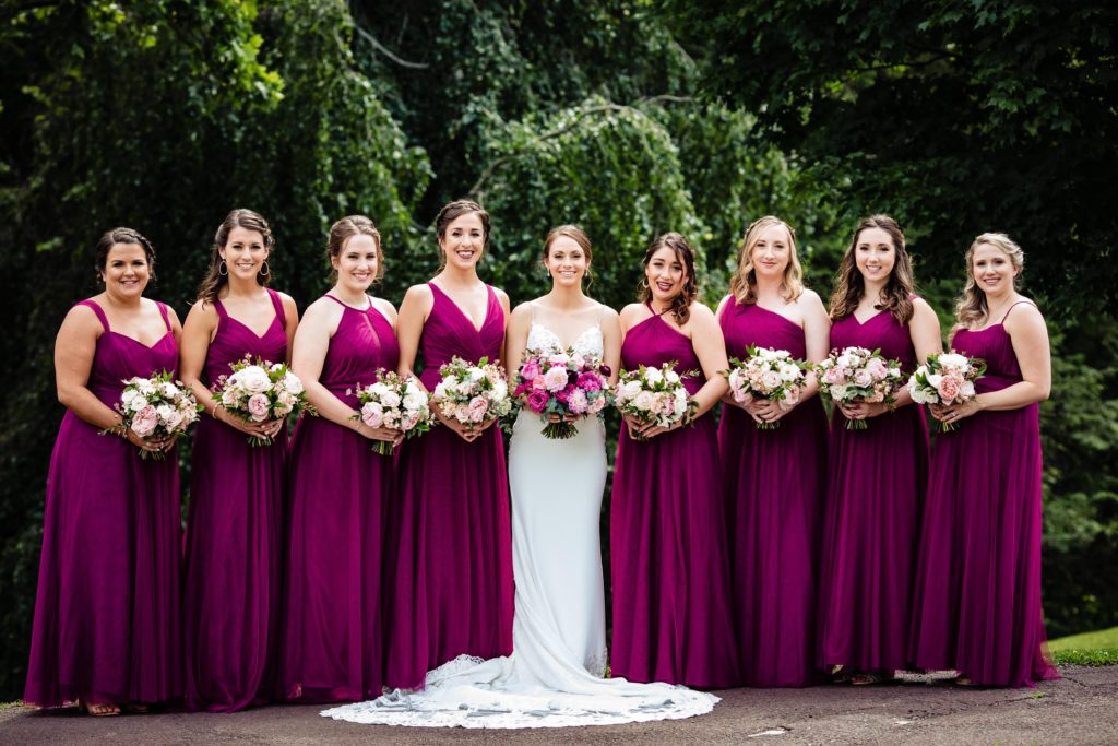 Fun Pink Garden wedding bridal party bouquets with dahlias, garden roses and ranunculus at John James Audubon Center by Sebesta Design photographed by Morby Photography