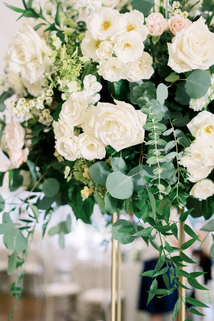 Classic Timeless Garden Party Wedding Reception, Tall gold stands topped with centerpieces of garden greenery, tardiva hydrangea, ivory spray roses, blush spray roses, delphinium and white roses. Designed by Sebesta Design at Congress Hall in Cape May, NJ. photography by Rachel Pearlman Photography