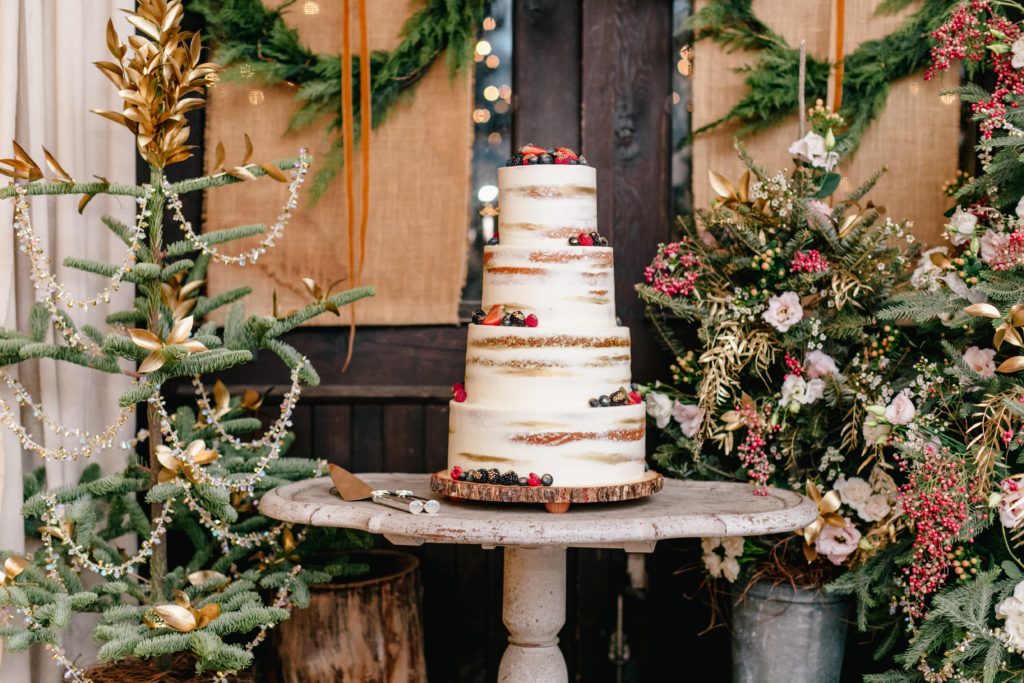 Floral decorated Christmas trees by Sebesta Design at a Winter Terrain wedding.