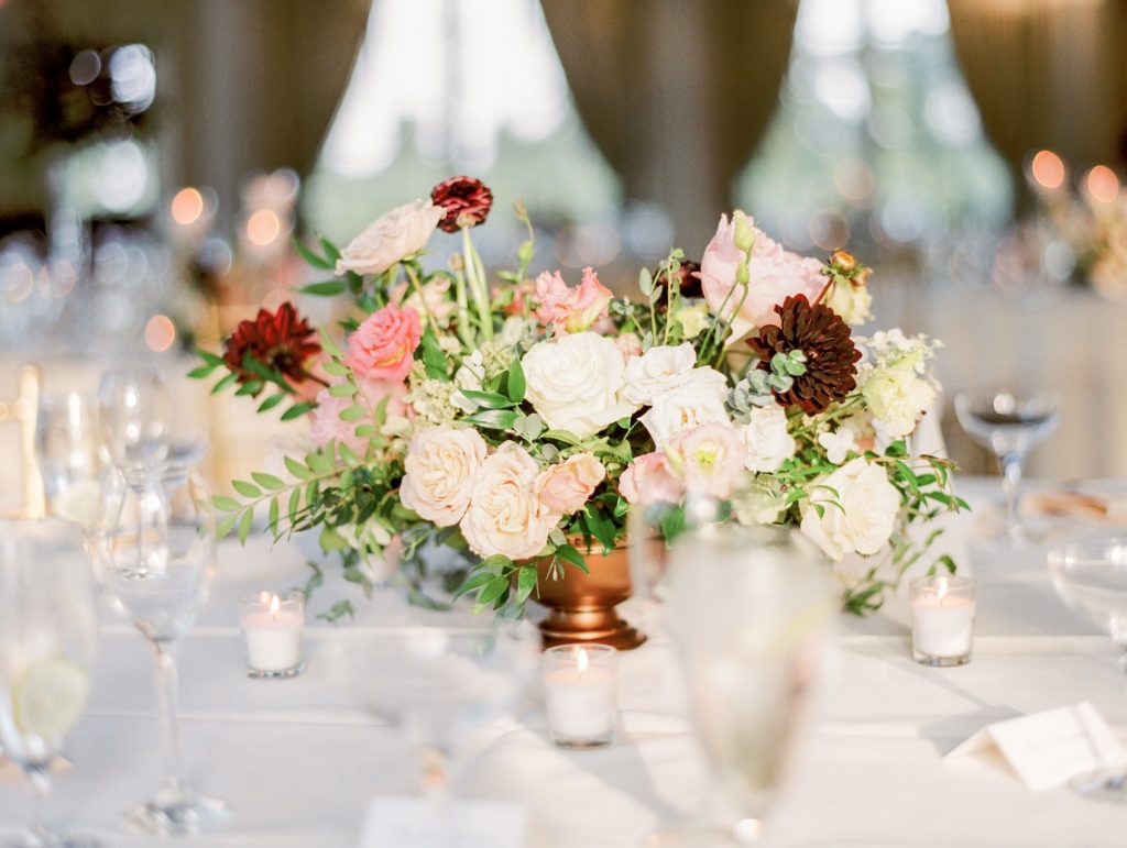 Fall wedding organic compote centerpiece comprised of garden roses, chocolate dahlias, plum foliage, astilbe, ranunculus, jasmine vine, lisianthus and garden grown foliage at the Ashford Estate by Sebesta Design. Photo by Emily Wren Photography