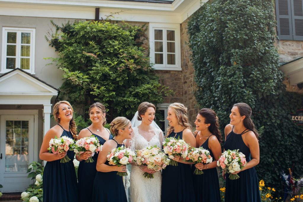 Elegant Secret Garden Wedding Party Bridesmaids bouquets with lush white and blush flowers and a touch of green at The Inn at Barley Sheaf Farm by Sebesta Design. Photography by Juliana Laury Photography