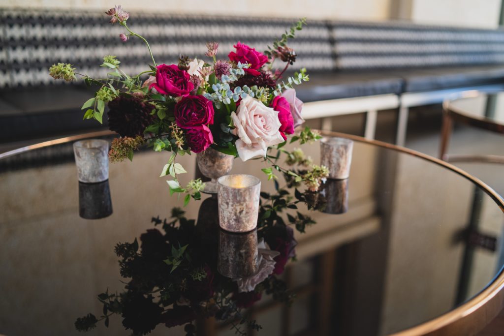 Modern Organic Museum Wedding Compote Centerpiece with garden roses and black dahlias at the Barnes Foundation by Sebesta Design. Photography by Max Grudzinski Photography 