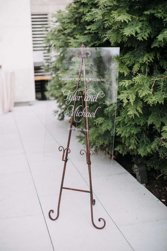 Boho Garden Summer Wedding Lucite Welcome Sign by Sebesta Design at the Barnes Foundation. Photography by Love Me Do Photography