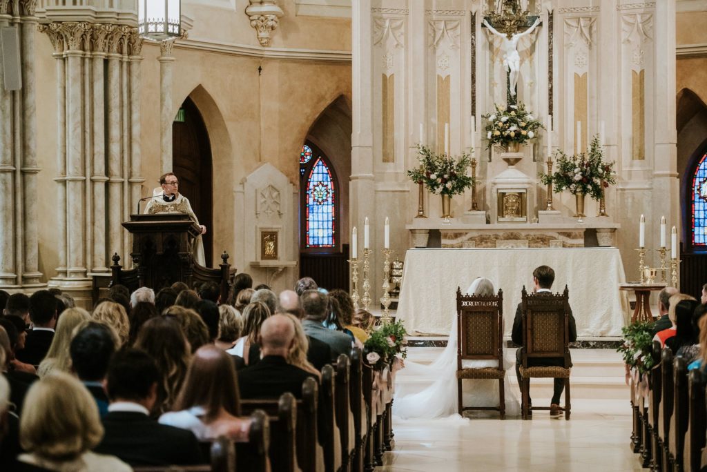 Old World Romantic Wedding Ceremony at St John The Evangelist Roman Catholic Church with organic altar arrangements and pew ends designed by Sebesta Design. Photography by M2 Photography.