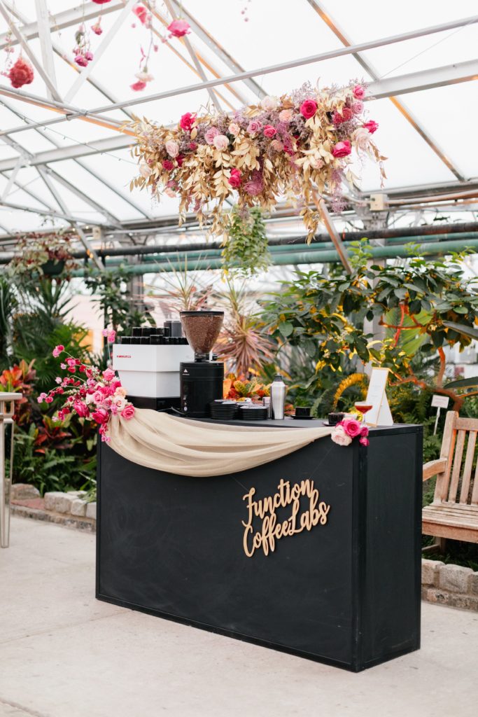 Love is in the Air styled shoot and bespoke bridal event at the Horticulture Center, Function Coffee Labs specialty pop up coffee bar featuring luxe hanging floral decor, sweeping gold tulle and specialty signage by EverLaser. Event design and florals by Sebesta Design. Photography by Emily Wren Photography. 