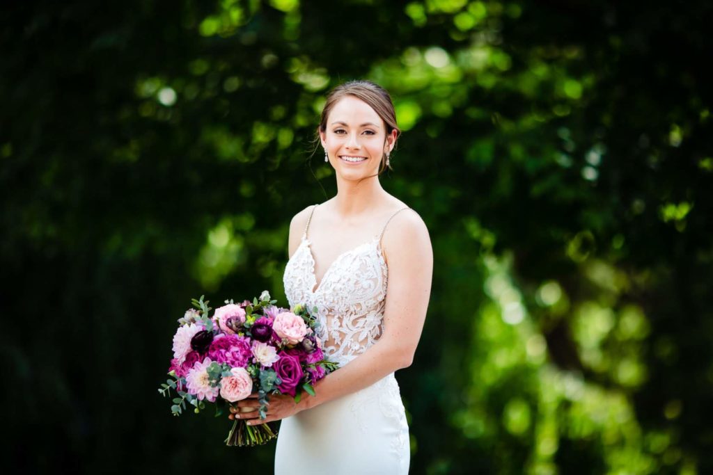 Fun Pink Garden wedding bridal bouquet with dahlias, garden roses and ranunculus at John James Audubon Center by Sebesta Design photographed by Morby Photography